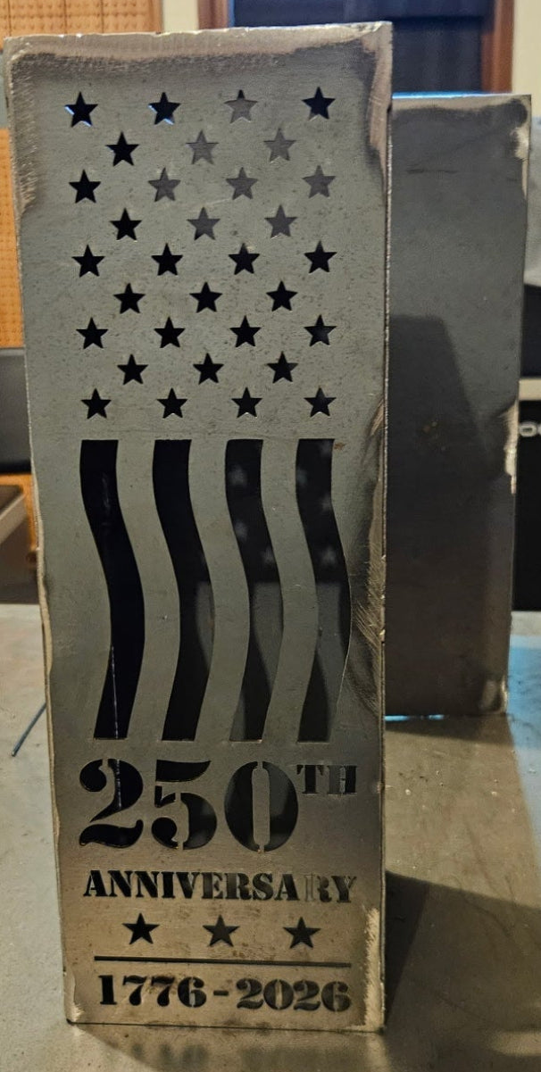 Iron Canvas Commemorative 250 Lantern in Raw Steel finish showing 250th Anniversary 1776-2026 engraving — shop photo