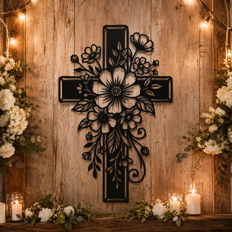 Floral cross laser-cut steel metal wall art displayed in rustic farmhouse setting with candles and flowers